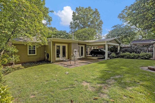 4141 Sequoia Ave, Memphis, TN 38117 - back of house featuring brick siding and a carport