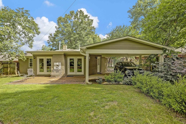 4141 Sequoia Ave, Memphis, TN 38117 - back of property featuring french doors, brick siding, and a chimney