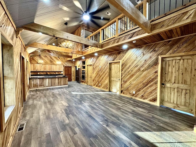 0 Tyson Rd, Toone, TN 38381 - unfurnished living room featuring wooden walls, a ceiling fan, wood finished floors, a chandelier, and beam ceiling