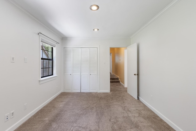 1021 N Barksdale St, Memphis, TN 38107 - unfurnished bedroom featuring crown molding, carpet, a closet, baseboards, and recessed lighting