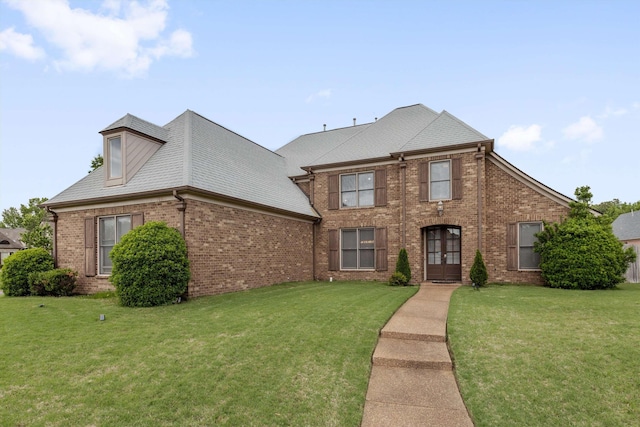 10516 Denali Park Cv, Collierville, TN 38017 - traditional-style home with brick siding, french doors, and a front lawn