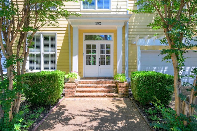 182 Harbor Isle Cir, Memphis, TN 38103 - view of exterior entry with french doors and an attached garage