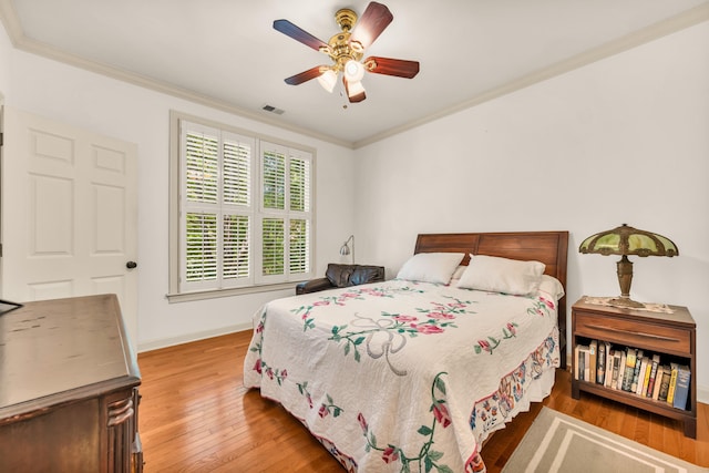 182 Harbor Isle Cir, Memphis, TN 38103 - bedroom featuring ornamental molding, hardwood / wood-style floors, baseboards, and a ceiling fan