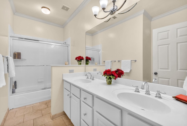 182 Harbor Isle Cir, Memphis, TN 38103 - bathroom with double vanity, crown molding, enclosed tub / shower combo, a chandelier, and toilet