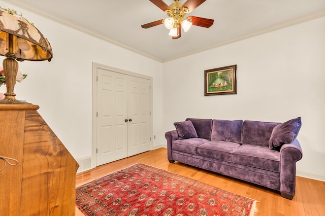 182 Harbor Isle Cir, Memphis, TN 38103 - living room with a ceiling fan, ornamental molding, wood finished floors, and baseboards