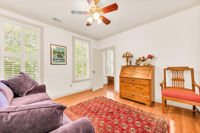 182 Harbor Isle Cir, Memphis, TN 38103 - sitting room with healthy amount of natural light, ornamental molding, light wood-style flooring, a ceiling fan, and baseboards