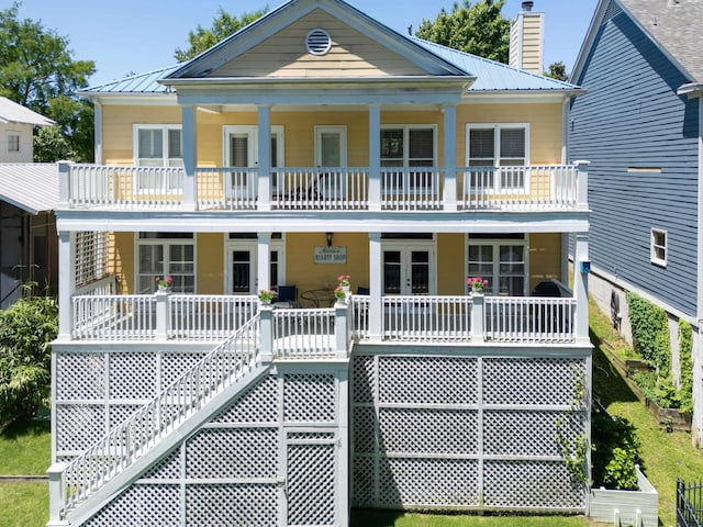 182 Harbor Isle Cir, Memphis, TN 38103 - view of front of house featuring a porch, french doors, stairway, a balcony, and metal roof