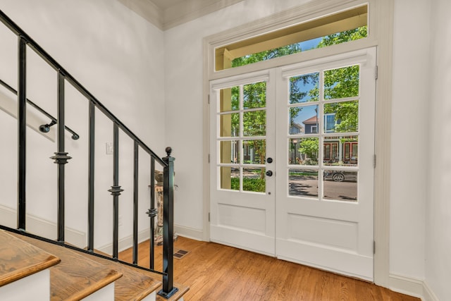 182 Harbor Isle Cir, Memphis, TN 38103 - doorway featuring stairway, light wood finished floors, baseboards, and french doors