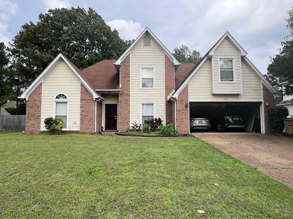 474 W Sanga Cir, Memphis, TN 38018 - traditional home featuring an attached garage, concrete driveway, and brick siding
