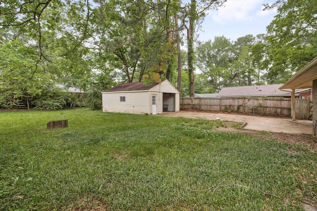 307 Melita Rd, Memphis, TN 38120 - view of yard featuring an outdoor structure, a detached garage, and a patio