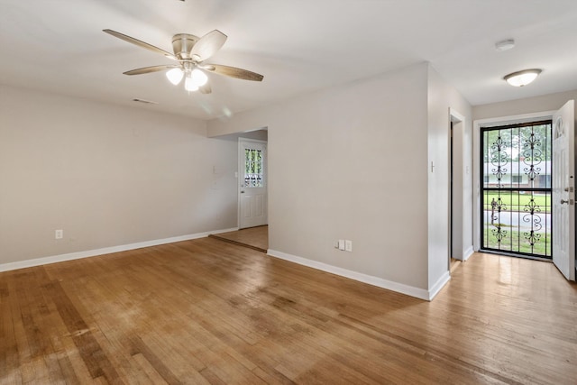 307 Melita Rd, Memphis, TN 38120 - unfurnished room featuring plenty of natural light, a ceiling fan, baseboards, and light wood-style flooring