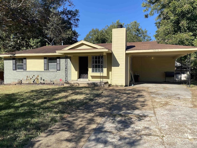 4219 Coventry Ave, Memphis, TN 38127 - single story home with a chimney, driveway, a front lawn, brick siding, and a carport