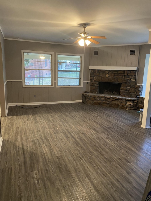 4219 Coventry Ave, Memphis, TN 38127 - unfurnished living room with dark wood-style floors, crown molding, a ceiling fan, and a fireplace