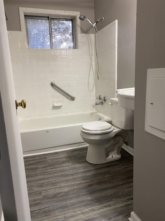 4219 Coventry Ave, Memphis, TN 38127 - bathroom featuring toilet, shower / bath combination, wood finished floors, and baseboards