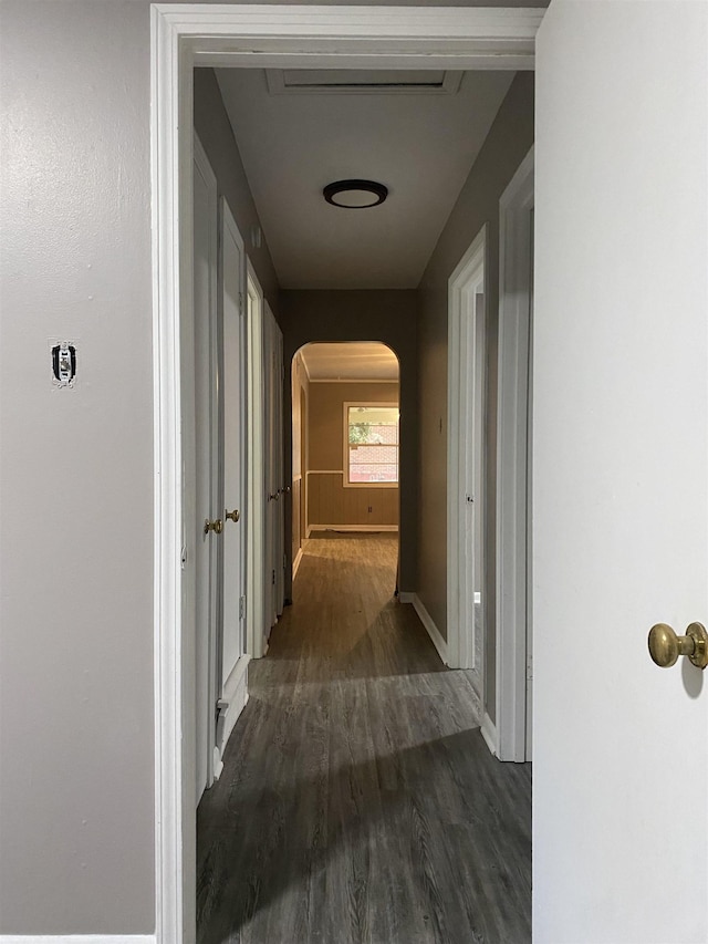 4219 Coventry Ave, Memphis, TN 38127 - hall featuring arched walkways, dark wood finished floors, and baseboards