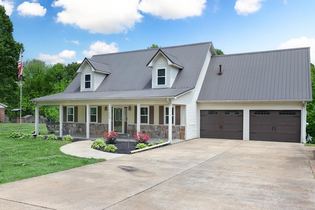 1498 Glen Springs Rd, Drummonds, TN 38023 - view of front of home featuring driveway, a porch, an attached garage, a front lawn, and metal roof