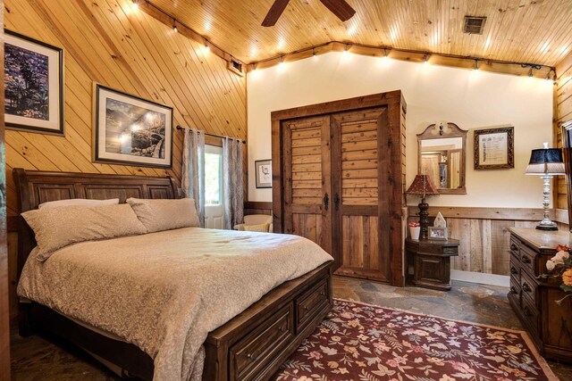1940 Nuckolls Rd, Rossville, TN 38066 - bedroom featuring wooden walls, wood ceiling, rail lighting, a wainscoted wall, and vaulted ceiling