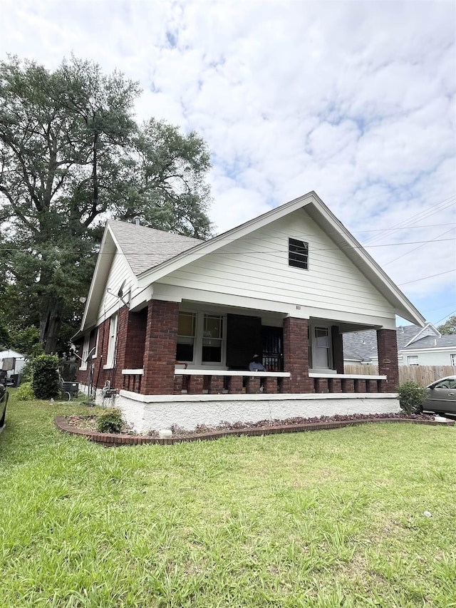 801 Spring St, Memphis, TN 38112 - view of front of property featuring brick siding and a front yard
