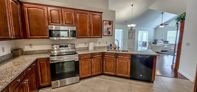 1601 E Southfield Cir, Memphis, TN 38016 - kitchen with appliances with stainless steel finishes, a sink, lofted ceiling, a peninsula, and a ceiling fan