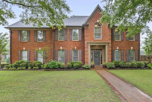 2045 Gallina Cir, Collierville, TN 38017 - colonial inspired home with brick siding, a front lawn, and roof with shingles