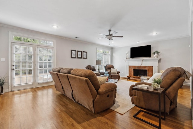 2045 Gallina Cir, Collierville, TN 38017 - living area with a ceiling fan, a fireplace, wood finished floors, ornamental molding, and recessed lighting