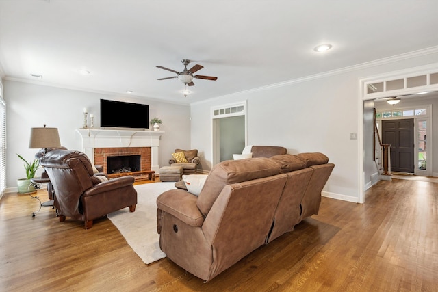 2045 Gallina Cir, Collierville, TN 38017 - living room featuring a ceiling fan, wood finished floors, a fireplace, ornamental molding, and recessed lighting
