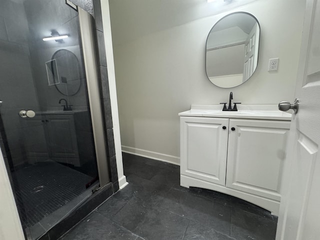 929 Garland St, Memphis, TN 38107 - bathroom with vanity, a stall shower, and baseboards