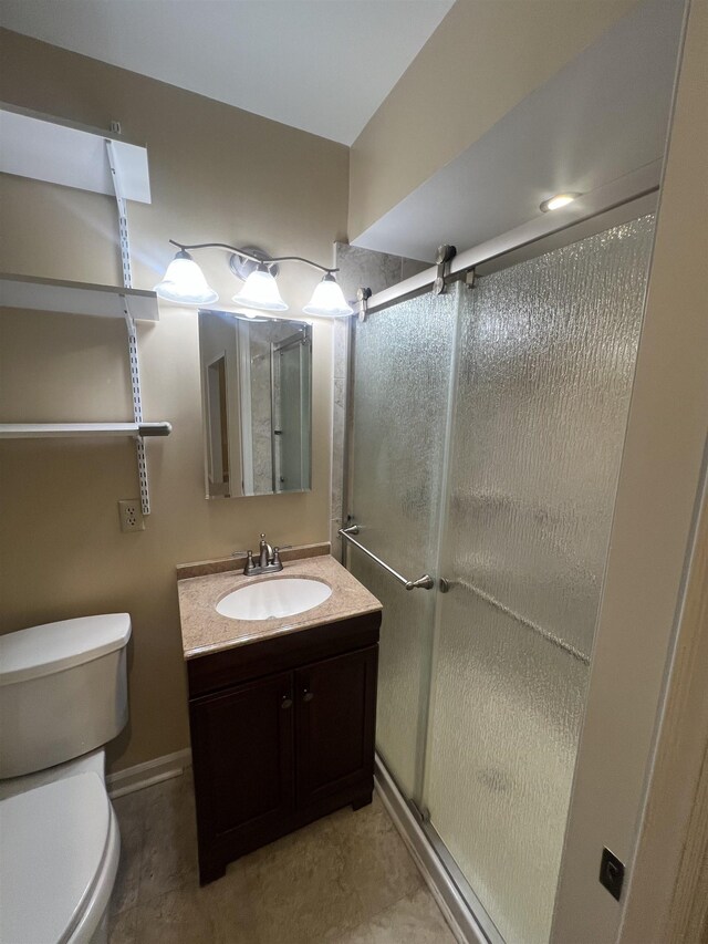 5001 Scheibler Rd Unit B4, Memphis, TN 38128 - bathroom featuring toilet, vanity, and a shower stall