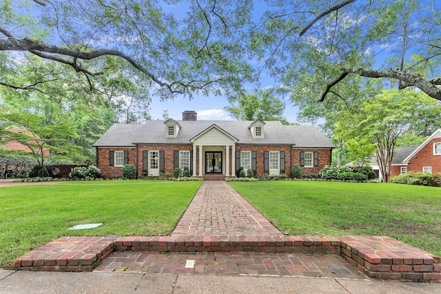 274 S Grove Park Rd, Memphis, TN 38117 - new england style home featuring brick siding, a front lawn, a chimney, and roof with shingles