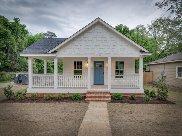 404 Williford Pl, Memphis, TN 38112 - bungalow-style home featuring a porch and a shingled roof