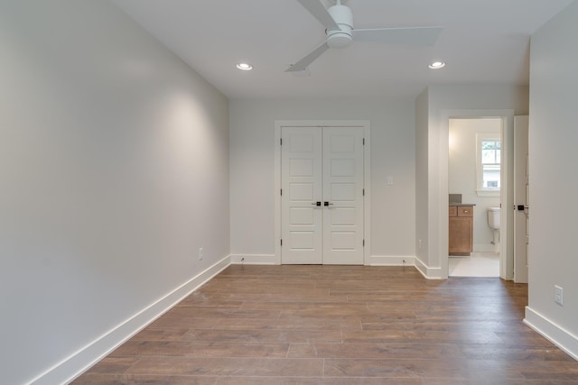 404 Williford Pl, Memphis, TN 38112 - unfurnished bedroom featuring recessed lighting, baseboards, dark wood-style floors, a closet, and a ceiling fan