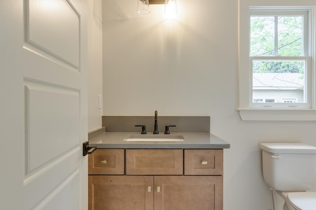 404 Williford Pl, Memphis, TN 38112 - bathroom featuring toilet, vanity, and healthy amount of natural light