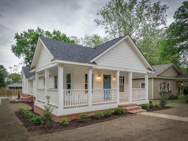 404 Williford Pl, Memphis, TN 38112 - view of front of house with covered porch and roof with shingles