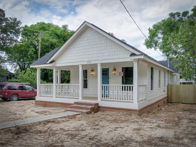 404 Williford Pl, Memphis, TN 38112 - bungalow-style home with a porch and a shingled roof