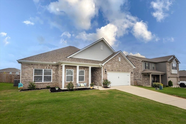 52 Twin Lakes Dr, Byhalia, MS 38611 - view of front of home featuring driveway, an attached garage, brick siding, central AC unit, and a shingled roof
