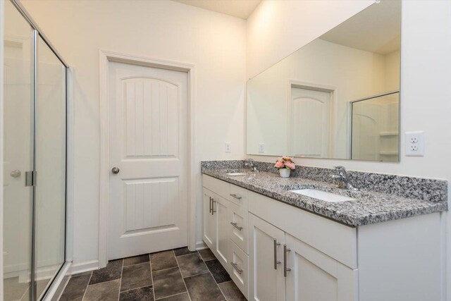 52 Twin Lakes Dr, Byhalia, MS 38611 - full bath with double vanity, a shower stall, and stone finish flooring
