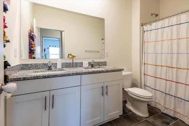 52 Twin Lakes Dr, Byhalia, MS 38611 - full bathroom with double vanity, toilet, curtained shower, and tile patterned flooring