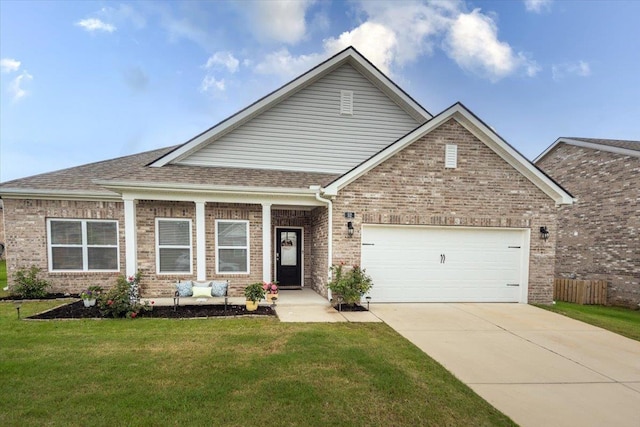 52 Twin Lakes Dr, Byhalia, MS 38611 - craftsman-style house featuring brick siding, concrete driveway, a front lawn, a garage, and roof with shingles