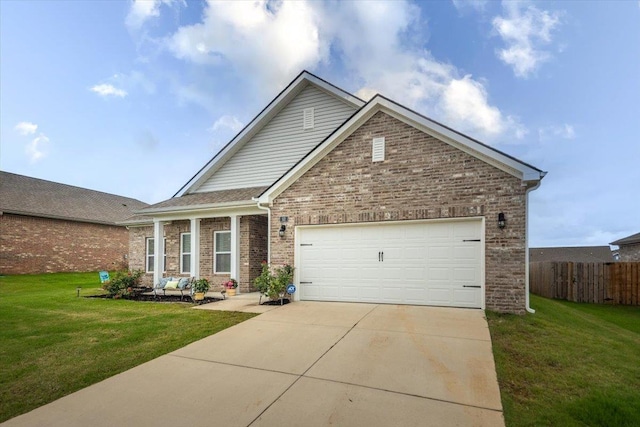 52 Twin Lakes Dr, Byhalia, MS 38611 - view of front facade with driveway, brick siding, and a garage