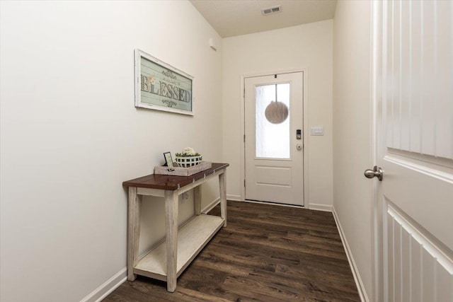 52 Twin Lakes Dr, Byhalia, MS 38611 - doorway to outside with dark wood-style flooring and baseboards
