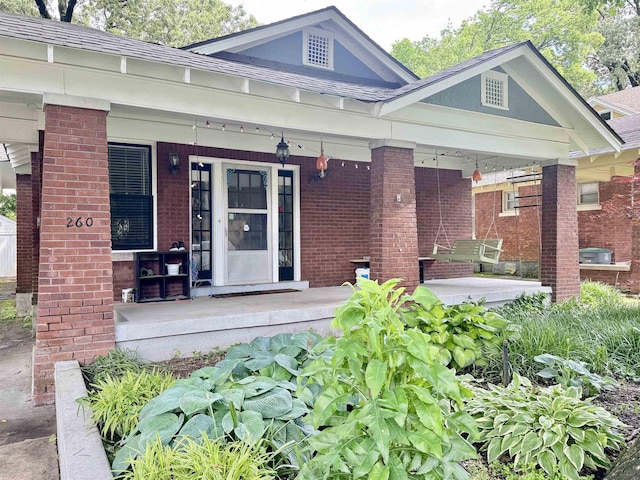 260 N Willett St, Memphis, TN 38112 - view of exterior entry with covered porch and brick siding