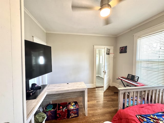 260 N Willett St, Memphis, TN 38112 - bedroom with wood finished floors, crown molding, baseboards, and ceiling fan