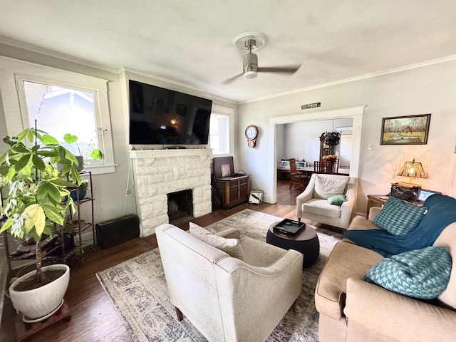 260 N Willett St, Memphis, TN 38112 - living area featuring wood finished floors, a ceiling fan, ornamental molding, and a fireplace