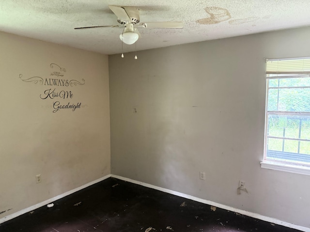 3701 Dorado Cv, Memphis, TN 38128 - spare room featuring baseboards, a ceiling fan, and a textured ceiling