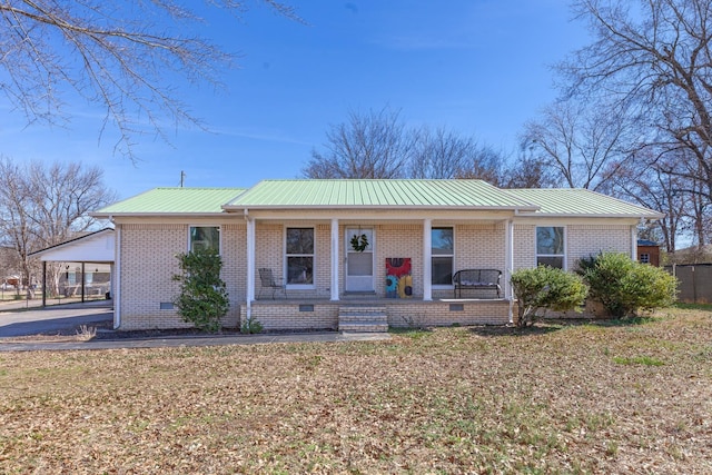 45 Daniel St, Savannah, TN 38372 - single story home featuring a porch, crawl space, metal roof, and brick siding