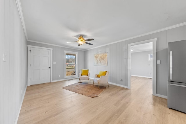 45 Daniel St, Savannah, TN 38372 - sitting room featuring ornamental molding, light wood-style flooring, a ceiling fan, and baseboards