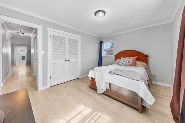45 Daniel St, Savannah, TN 38372 - bedroom with light wood-style flooring, attic access, crown molding, a closet, and baseboards