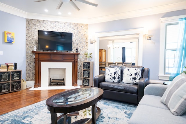 431 N Holmes St, Memphis, TN 38112 - living area featuring a ceiling fan, a fireplace with flush hearth, crown molding, wood finished floors, and recessed lighting