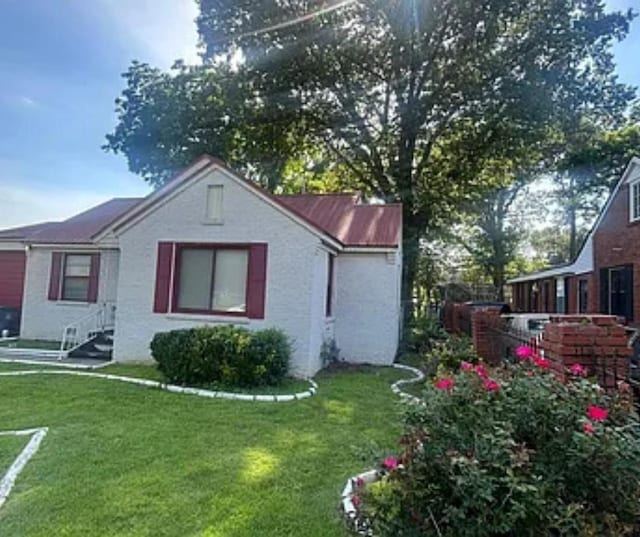 931 Maxey St, Memphis, TN 38111 - view of property exterior featuring a yard