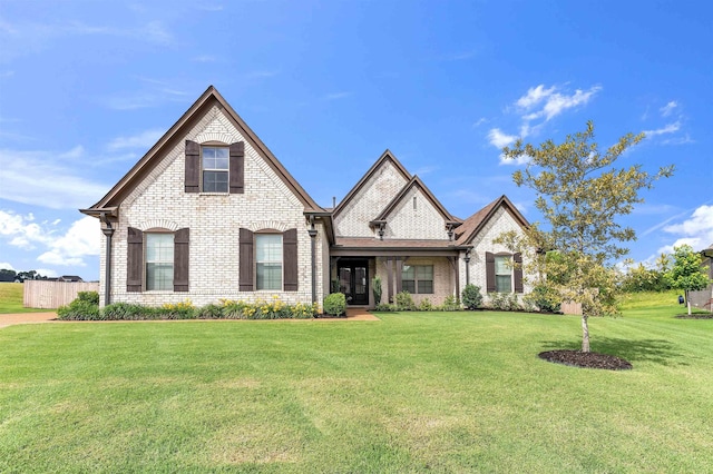 45 Laurel Hedge Cv, Oakland, TN 38060 - french provincial home with a front lawn and brick siding